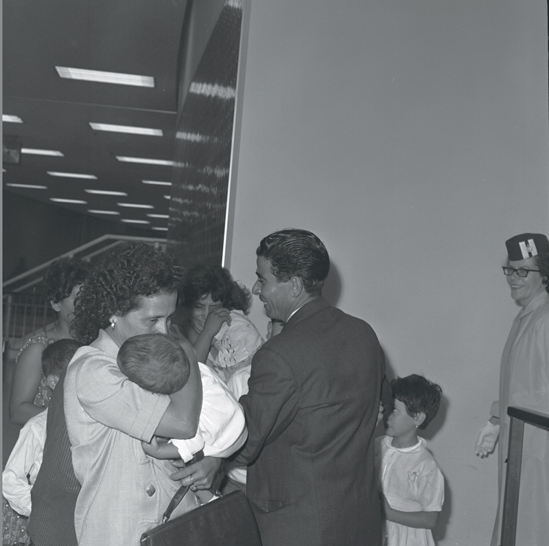 Big Italian family arrives at Malton airport, 1964. Image no. ASC02601.