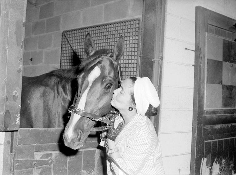 Mrs. Robert Marshal gives a horse a kiss, 1960.  Image no. ASC03720.