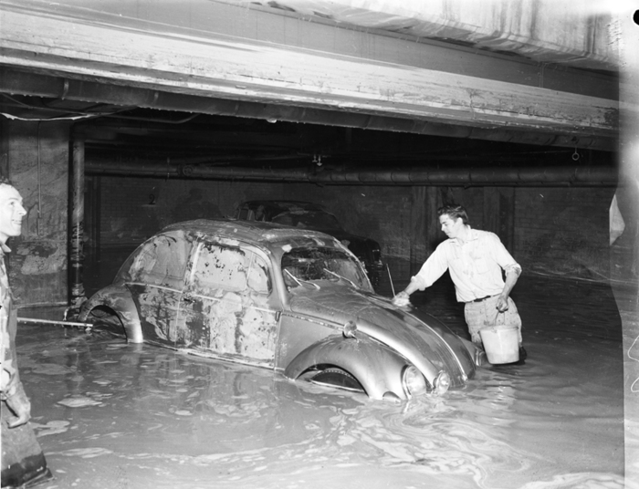 Historic photo of Washing a VW Beetle in a submerged parking garage at Maxwell and Eglinton from May 15th, 1958